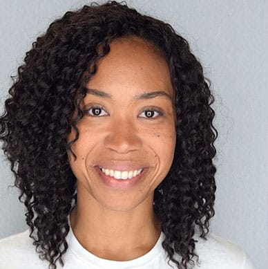 Image description: headshot of smiling woman, grey background