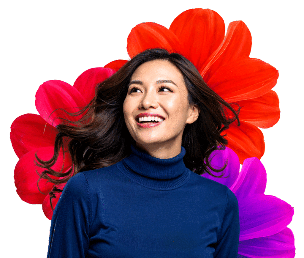 Lady wearing a blue top with flowers behind her